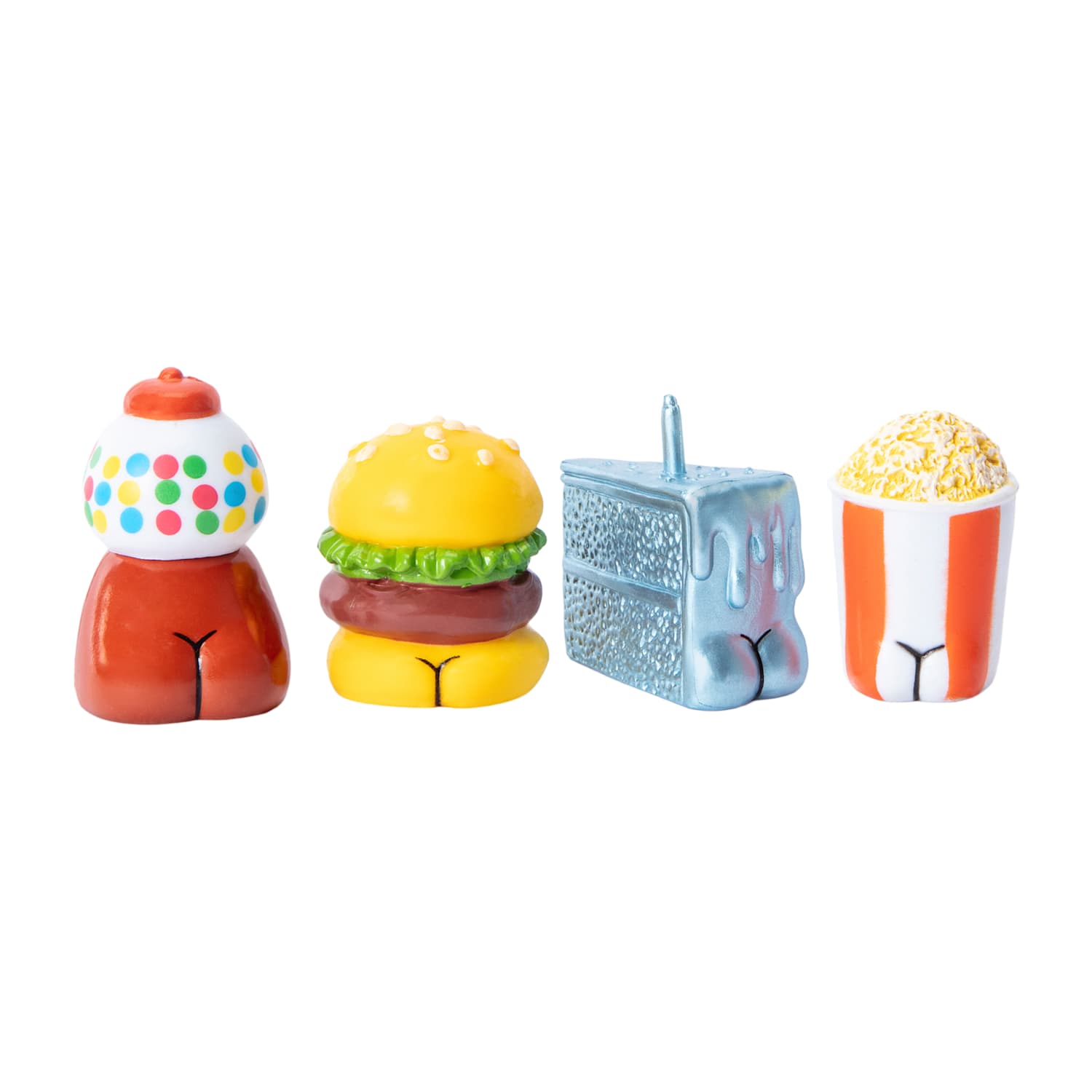 Four colorful miniature food items on a white background