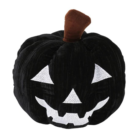 Front view of the black jack-o’-lantern pumpkin pillow with its product tag displayed beside the white facial design sold by LFG Energy Club.