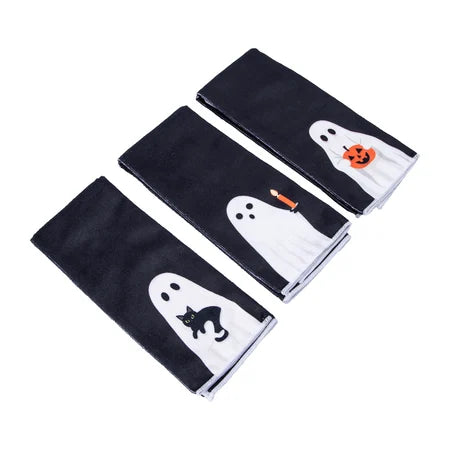 Angled view of three folded Halloween ghost dish towels displaying the cat, candle and pumpkin designs sold by LFG Energy Club.