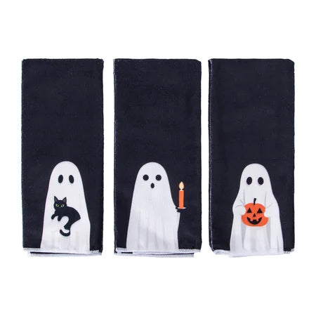 Three black Halloween dish towels featuring white ghosts with a black cat, orange candle and jack-o’-lantern bucket sold by LFG Energy Club.