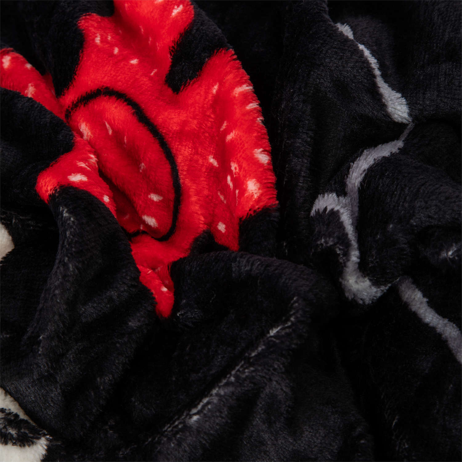 Close-up of black and red fabric with Stranger Things pattern