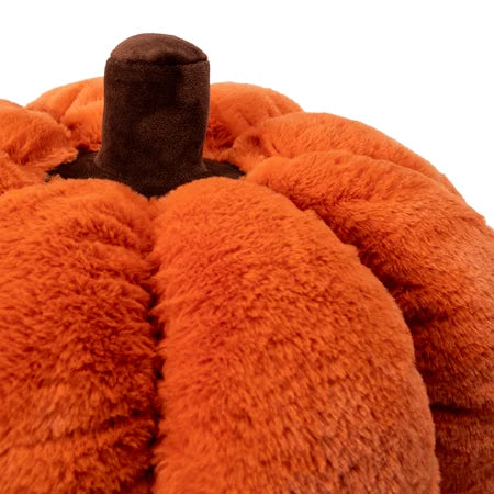 Close-up view of the orange Halloween pumpkin pillow showing its brown stem and textured surface sold by LFG Energy Club.