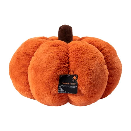 Rear view of the giant orange Halloween pumpkin pillow with its brown stem and product tag visible sold by LFG Energy Club.