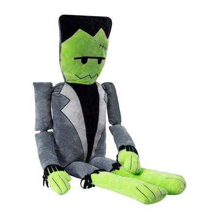 Seated angled view of the Halloween Frankenstein pillow plush with its green legs positioned in front sold by LFG Energy Club.