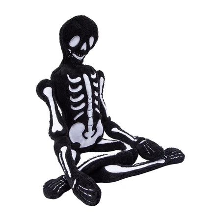 Angled view of the black-and-white Halloween skeleton pillow displayed in a seated position sold by LFG Energy Club.