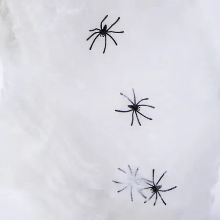 White stretchy spider web material displayed with black spider accents for a creepy Halloween look, available at LFG Energy Club.